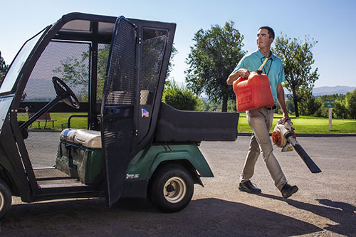 Golf course employee working safely