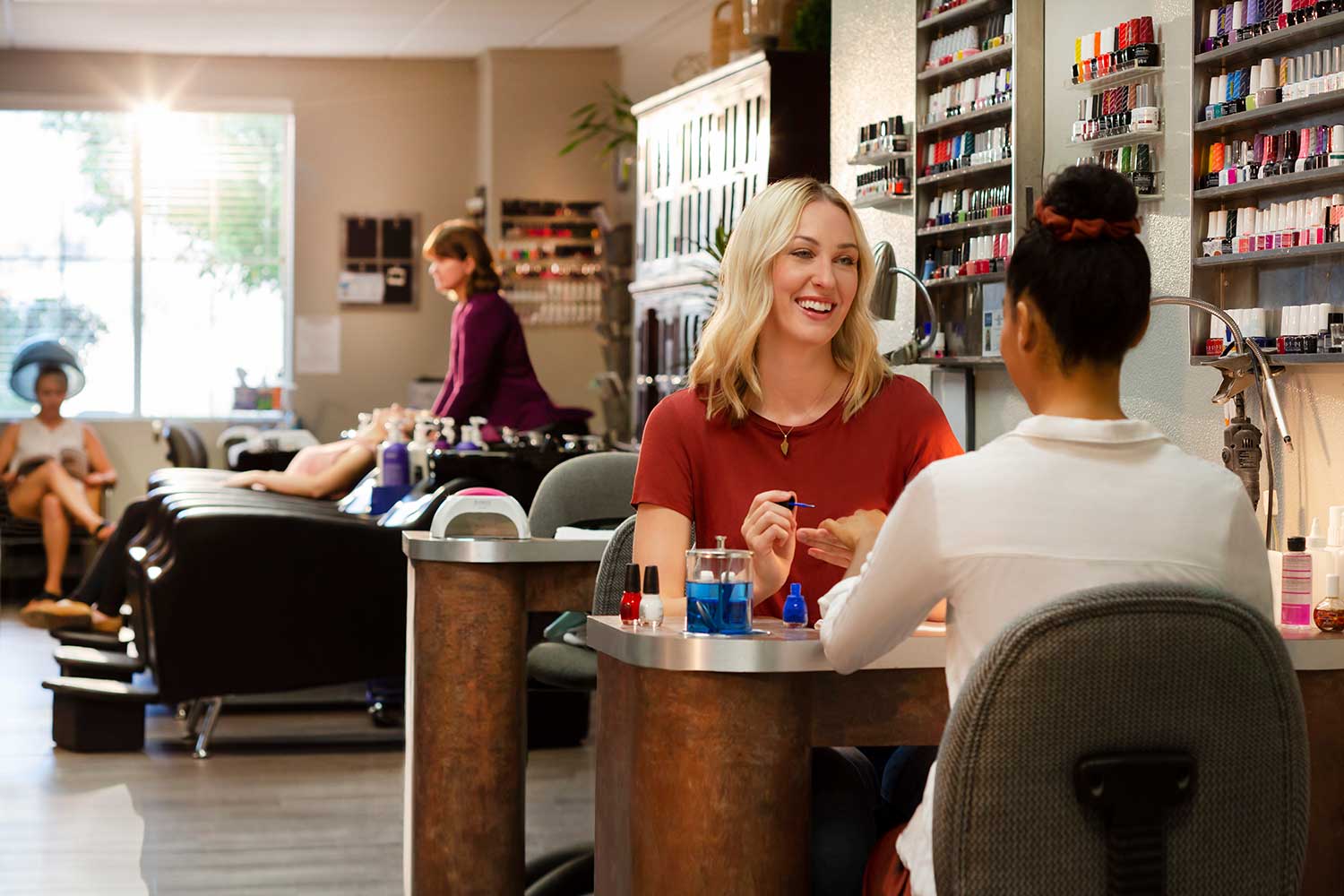 Woman giving a manicure in a salon