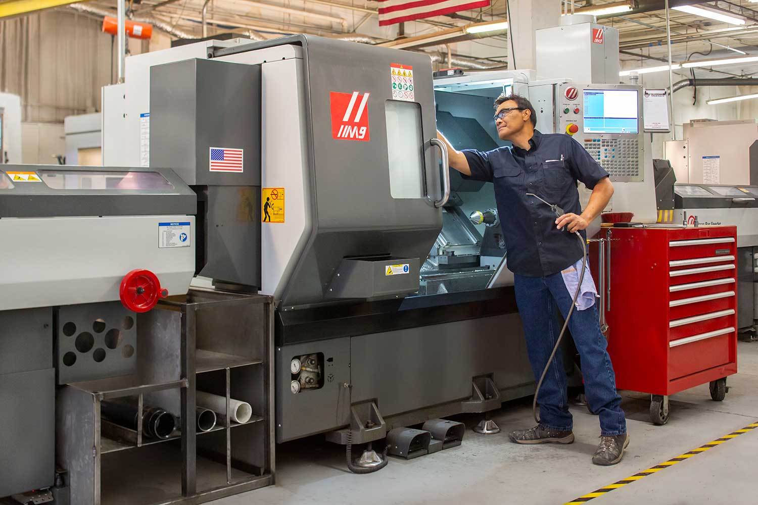 Man reaches into manufacturing machine
