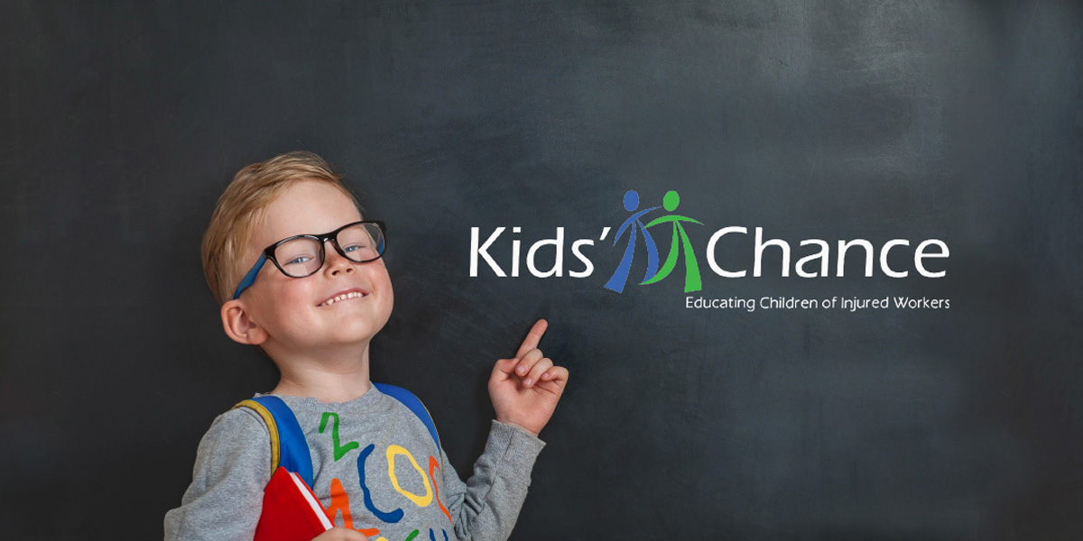 kid pointing to kids chance logo