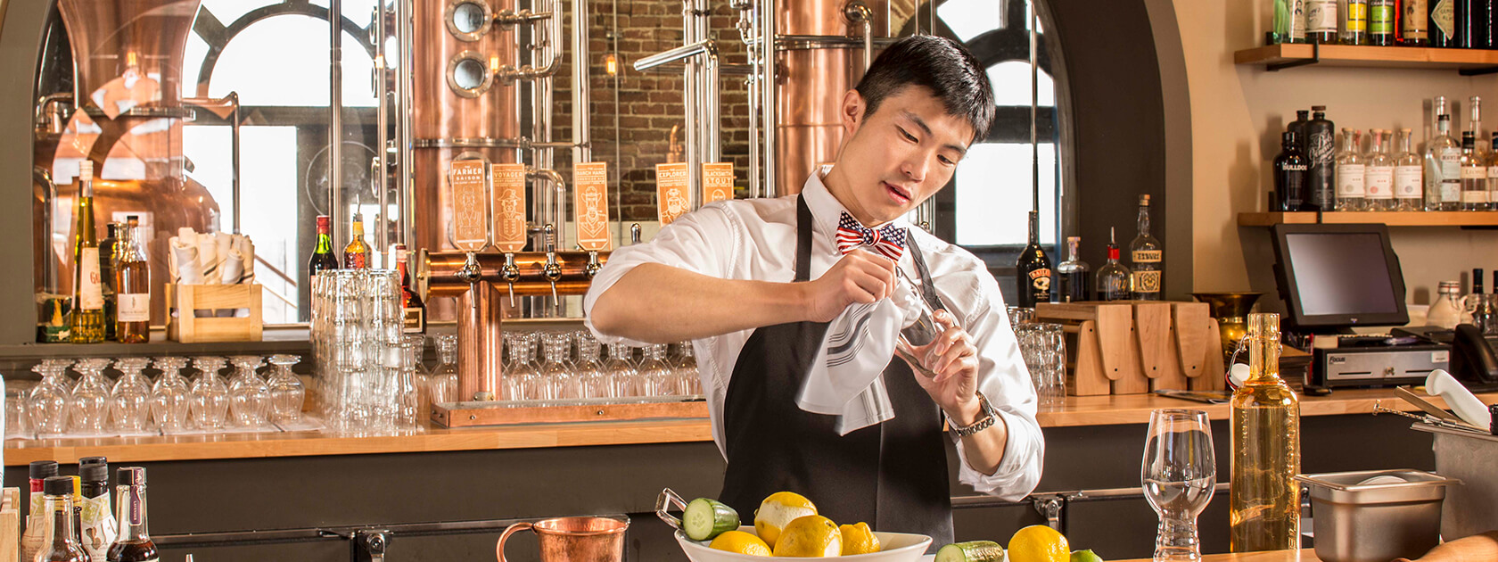 Bartender cleaning a glass